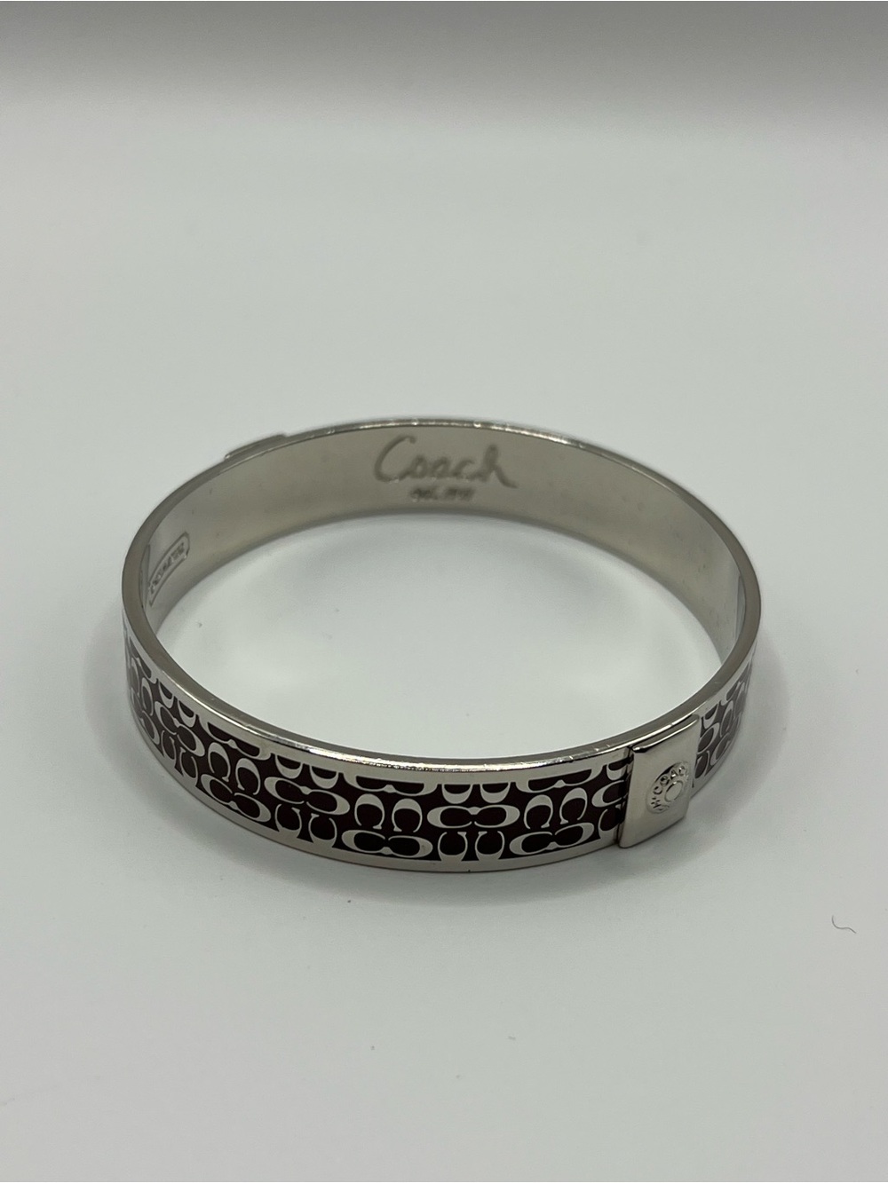 Coach Silver-Tone Cuff Bracelet with Burgundy Signature C Pattern Singed